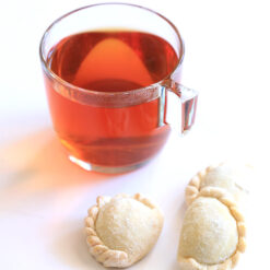 Almond Qottab with a glass of tea