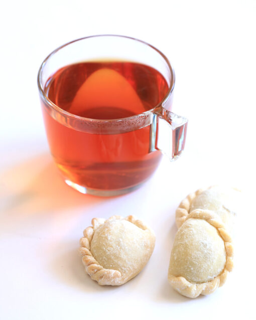 Almond Qottab with a glass of tea