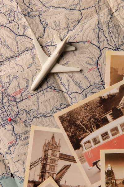 A colorful map featuring illustrations of a plane, a bus, and a tower, highlighting various travel routes and landmarks.